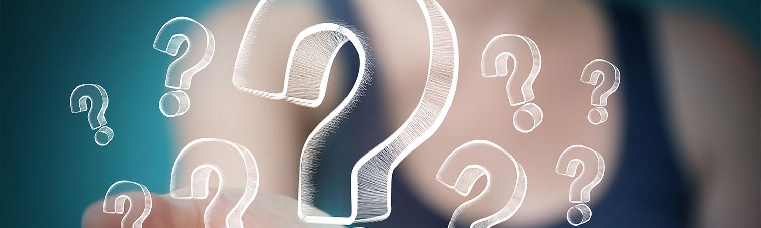 Close-up of floating question marks representing frequently asked questions about skip bin hire